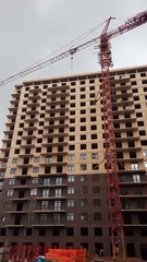 Construction of a multi-apartment residential building. The process of construction. Stages of construction.