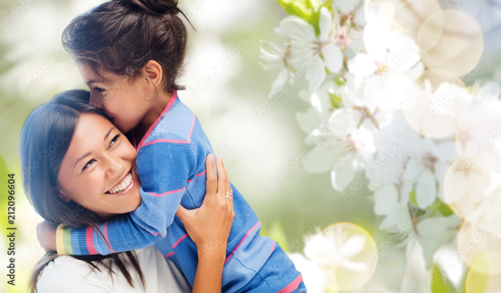 Canvas Prints family, motherhood and people concept - happy mother and daughter hugging and kissing over cherry bl