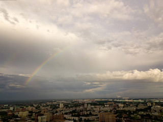 Naklejka na ściany i meble Two multicolored rainbows in the gray sky