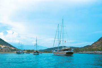 Fototapeta na wymiar Beautiful bay with sailing boats, Mediterranean sea. Yachting, travel and active lifestyle concept