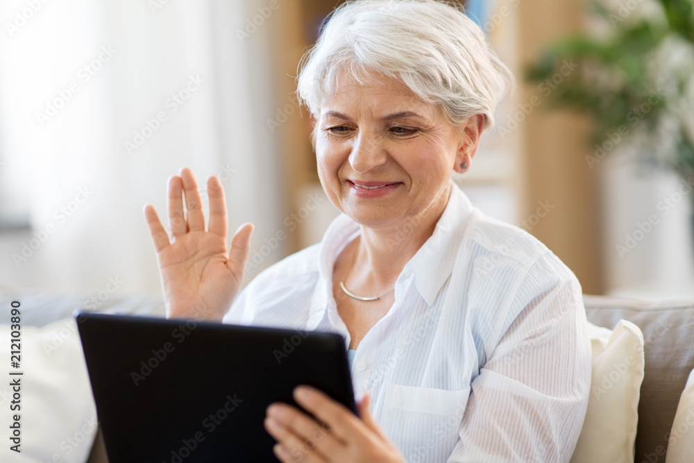 Wall mural technology, people and communication concept - happy senior woman with tablet pc computer having vid