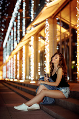 woman with coffee on the street