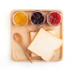 Toast sandwiches with strawberry, orange and blueberries jam isolated on white background, top view