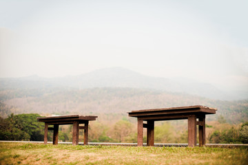 Old chair near the forest road near the mountain