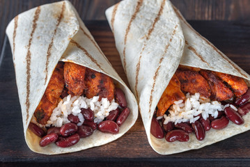 Chicken burritos on the wooden board