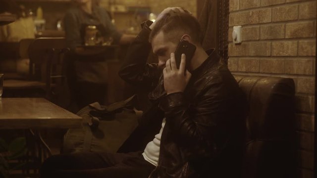business man thinking, drinking coffee and looking at the window in the pub