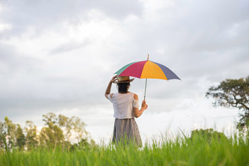 Woman holding an umbrella Meadows