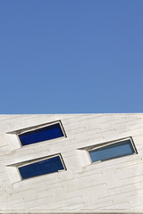 Abstract architecture background. Blue geometry against sky. Empty copy space for Editor's text.