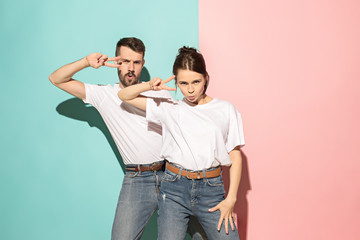 A couple of young man and woman dancing hip-hop at studio.