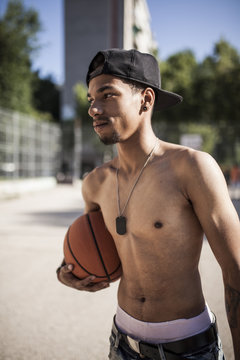 Afro young brothers play basketball