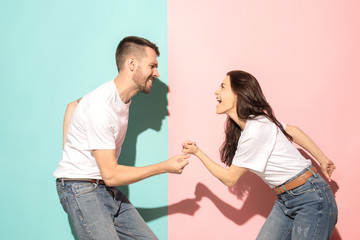 A couple of young man and woman dancing hip-hop at studio.