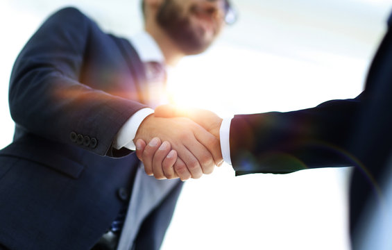 Successful Business People Handshaking After Good Deal.