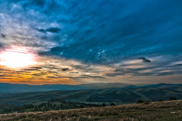 Scenic sunset view from the top of mountain ,Carpathian mountains in Transylvania, Romania.