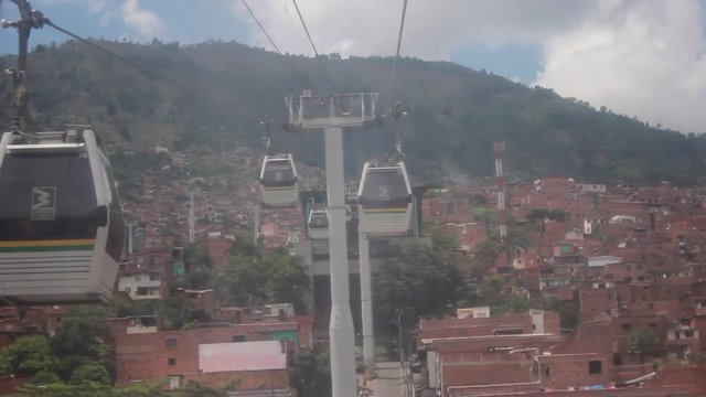 View of metrocable cabins from a moving booth