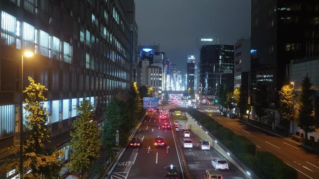 Tokyo street view and city traffic at night - TOKYO / JAPAN - JUNE 12, 2018