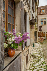 Fototapeta na wymiar View down a street in the beautiful town of Noyers sur Serein in Burgundy
