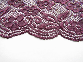 Obraz premium Dark lace fabric with festoons on white background