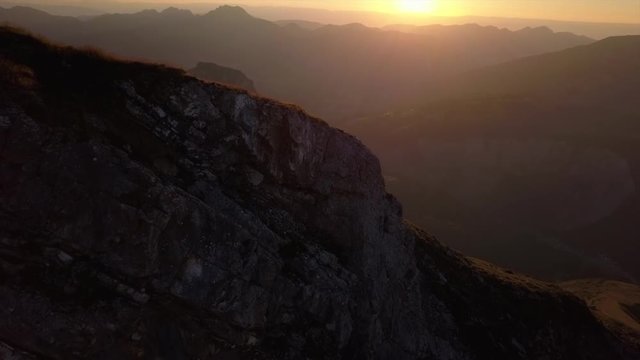 Aerial view of an alps summit at sunset with a cross. It's near Morzine, Avoriaz, Champery, and the Portes du Soleil.