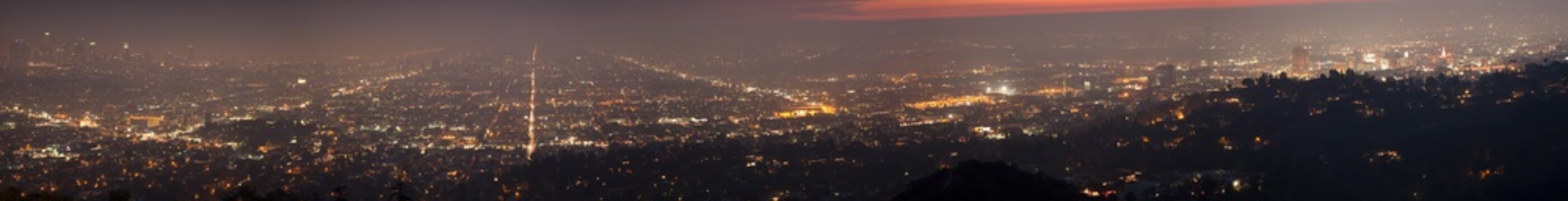 Night skyline of Los Angels viewed from Griffith Observatory in panorama.
