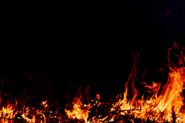 Fototapeta na wymiar Fire on black background