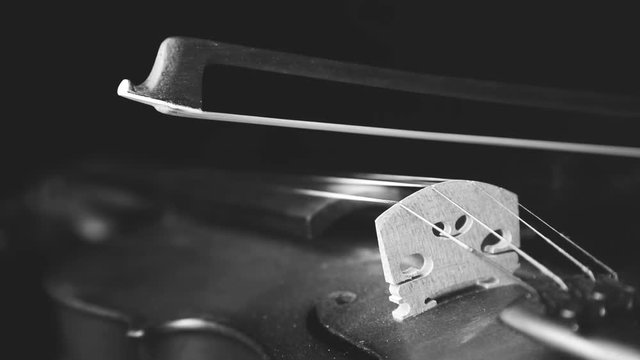 Close up smoke coming out from the violin and bow in the black background, Lowlight, Cinemagraph