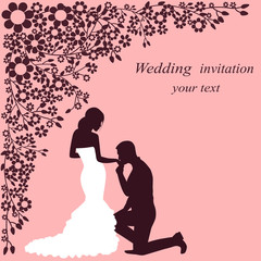 Invitation card with the bride and groom on a floral background.