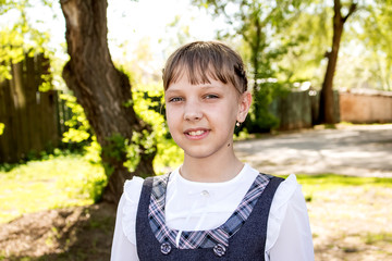 Portrait of a beautiful cheerful girl outdoors