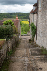 Fototapeta na wymiar View down a cobbled street in Vezelay, a small town in Burgundy, France