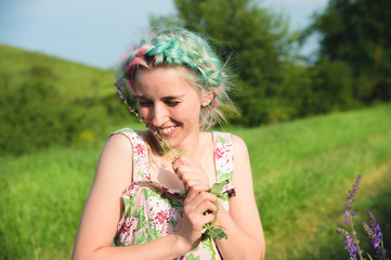 Portrait of a young happy smiling girl in a cotton dress with a bouquet of wildflowers - Powered by Adobe