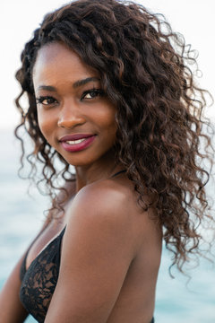 Charming black woman looking at camera
