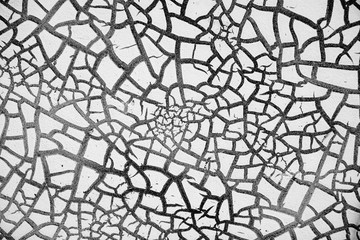 Obraz premium detail of cracked paint on wall. black and white