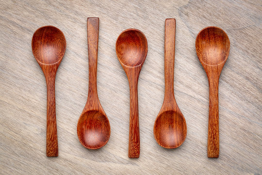 wooden teaspoons on grained wood