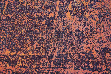 An old painted sheet of iron covered with rust. Abstract background.