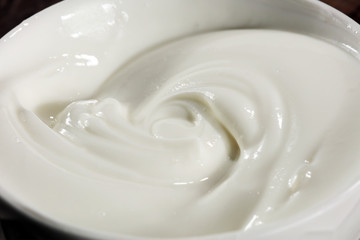 close up of a white whipped or sour cream in bowl.