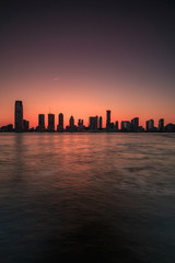 Fototapeta na wymiar Jersey city view from Hudson river at sunset