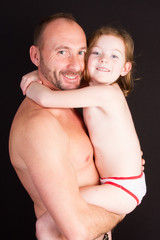 Fototapeta na wymiar handsome man in summer with child daughter in arms