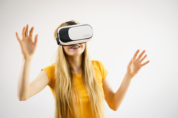Girl wearing virtual reality goggles.
