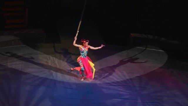 Air gymnast on canvases in circus