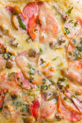 Italian pizza on wooden boards, pizza with bacon, dried tomatoes and Parmesan cheese, Italian cuisine, appetizing dish with meat and cheese, art