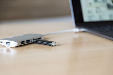USB adapter with a USB flash drive and Type-C connector installed in a laptop