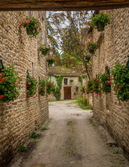 Flowers adorning an entrance to a cottage in Burgundy, France