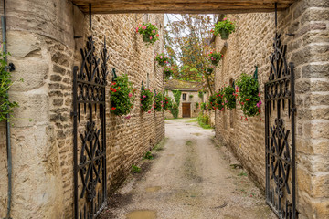 Flowers adorning an entrance to a cottage in Burgundy, France