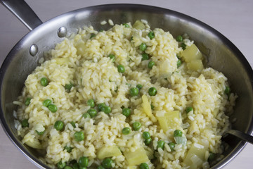 Vegetable risotto with saffron and green peas