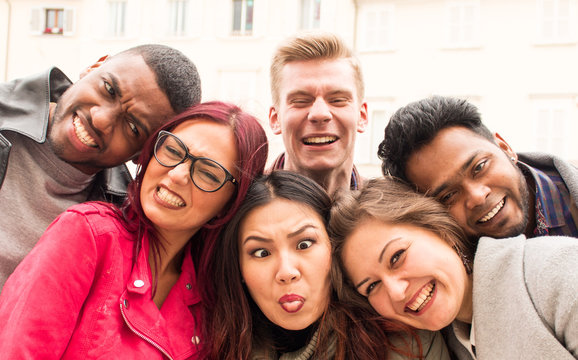 happy international team of college students of multi-ethnic origins, best friends making funny faces for a selfie photo.