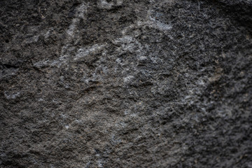 Abstract Texture of Natural rough untreated and unpolished grey white stone wall with grain surface.