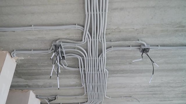 Electrical installation of plastic tubes on building site. Fix boxes, fire prevention cable tray wiring channels indoors, excellent electrical insulation. Living rooms electricity network connection