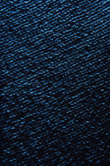 The texture is a blue jacket. Woolen threads