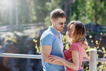 Couple of lovers spending time in a summer park.