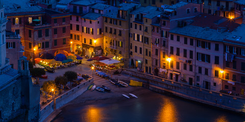 Fototapeta na wymiar Nightime view of the beautiful seaside of Vernazza village in summer in the Cinque Terre area, Italy