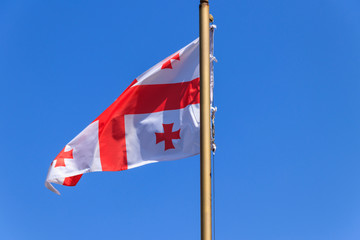 Georgian flag against blue sky
